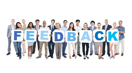 Multiethnic Business People Holding the Word Feedback