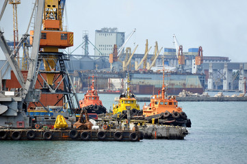 Tugboat and freight train under port crane, Odessa, Ukraine