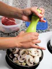 Close-up of human's hand cooking food