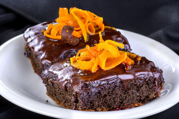 Delicious and sweet chocolate cake decorated with orange