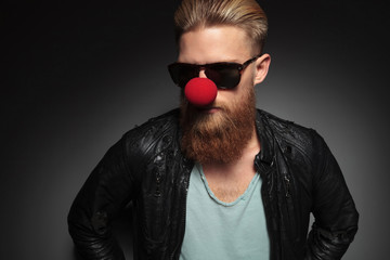 young bearded man with red clown nose