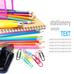 notebook and color pencils stationery isolated on white backgrou