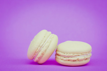 Sweet  french macaroons on retro-vintage background
