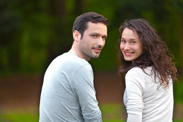 Fototapeta premium Portrait of a young happy couple in the nature