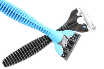 Safety black and blue plastic razor isolated on white.