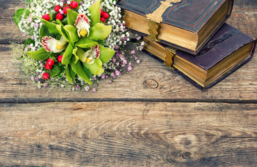 old books and orchid flowers