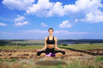 Naklejka na ściany i meble Beautiful girl fly and meditating in yoga pose
