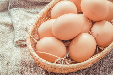 Easter egg in a basket  on wodden table