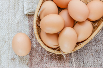 Easter egg in a basket  on wodden table