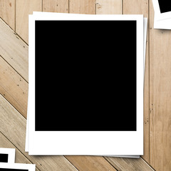 blank photo frame on brown wood plank background