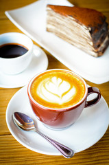 Close up Coffee latte art with cake