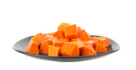 Dish of juicy papaya -tropical fruit on white