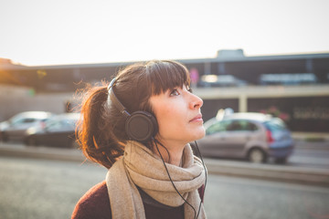 young beautiful hipster woman listening music