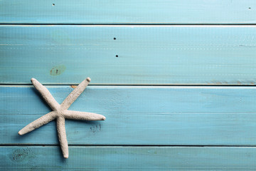 Starfish on wooden background