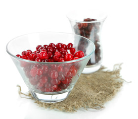 Fresh and dry cranberry in glass bowl, isolated on white