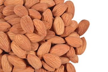 Heap of peeled almonds on a white
