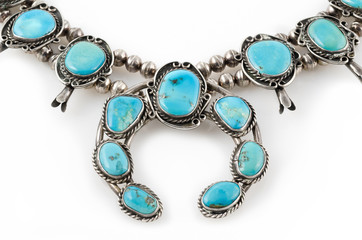 Detail of Silver and Turquoise Squash Blossom Necklace.