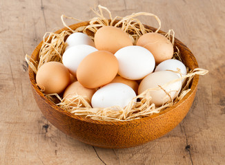 beautiful farm eggs in a wooden bowl