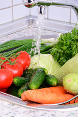 vegetables under running water vertical 0736