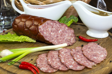 sausage on a wooden plate in a restaurant