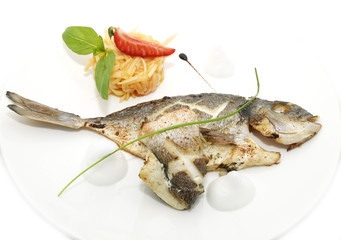 cooking fish on the grill in the restaurant