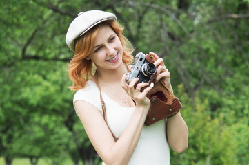 smiling girl in cap photographer