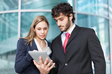 Business people using a tablet