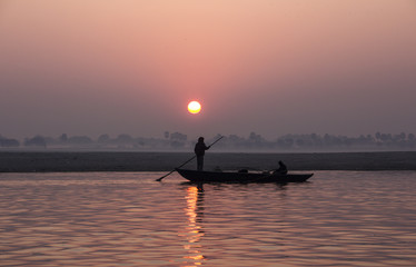fisherman on the ganges at sunrise