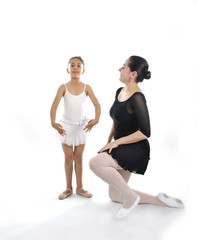 Obraz premium little girl ballerina learning dance lesson with ballet teacher