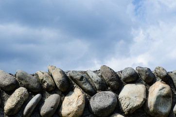 Ancient stone wall and sky in a castle in italy