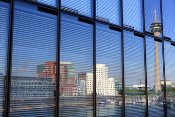 media harbor reflection in glass facade