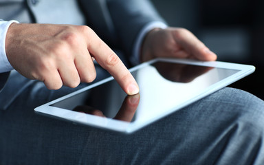 businessman touching screen of a tablet computer. 