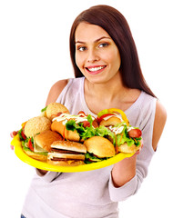 Woman eating fast food.