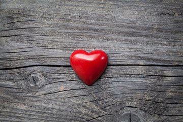 Fototapeta premium Red heart on the wooden background