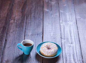 Donut on woodent table.