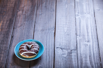 Donut on wooden table.