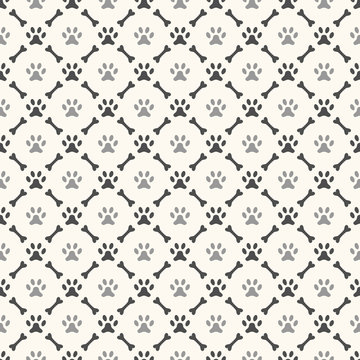 Fototapeta Seamless animal pattern of paw footprint and bone. Endless textu