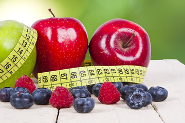 fresh fruit with measuring cintra concept of healthy diet