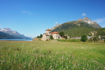 View of the lake Silvaplana a castle in the Swiss Alps