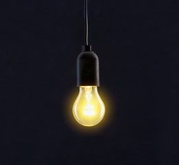 Light bulb lamp on black background