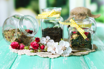 Assortment of herbs and tea in glass jars