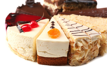 Assortment of pieces of cake, isolated on white © Africa Studio
