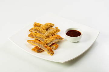 Sliced fish sticks and souce