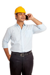 Asian engineer man talking on a phone smile and look up