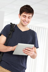 young student using tablet pc