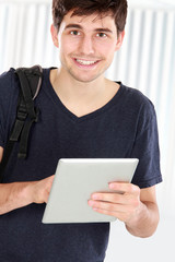 young student using tablet pc