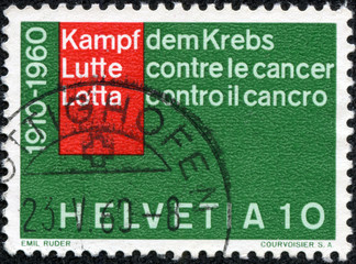 stamp printed in Switzerland shows inscription in 3 languages
