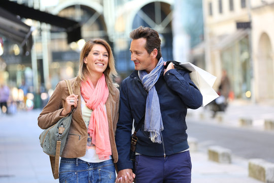 Middle-aged couple doing shopping on week-end