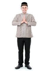smiling asian muslim man welcoming