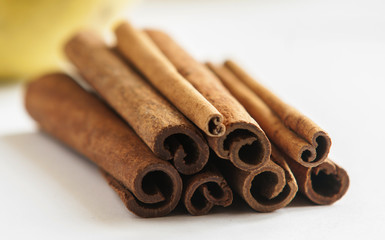 Cinnamon sticks on white background close up